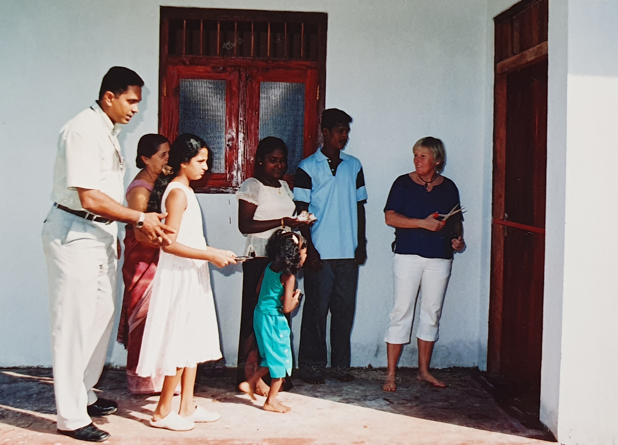 family in Sri Lanka receiving a new home