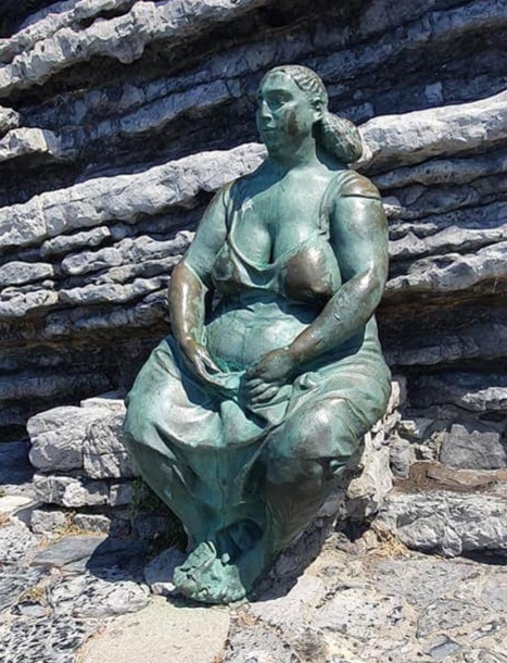 statue of a lady admiring the view
